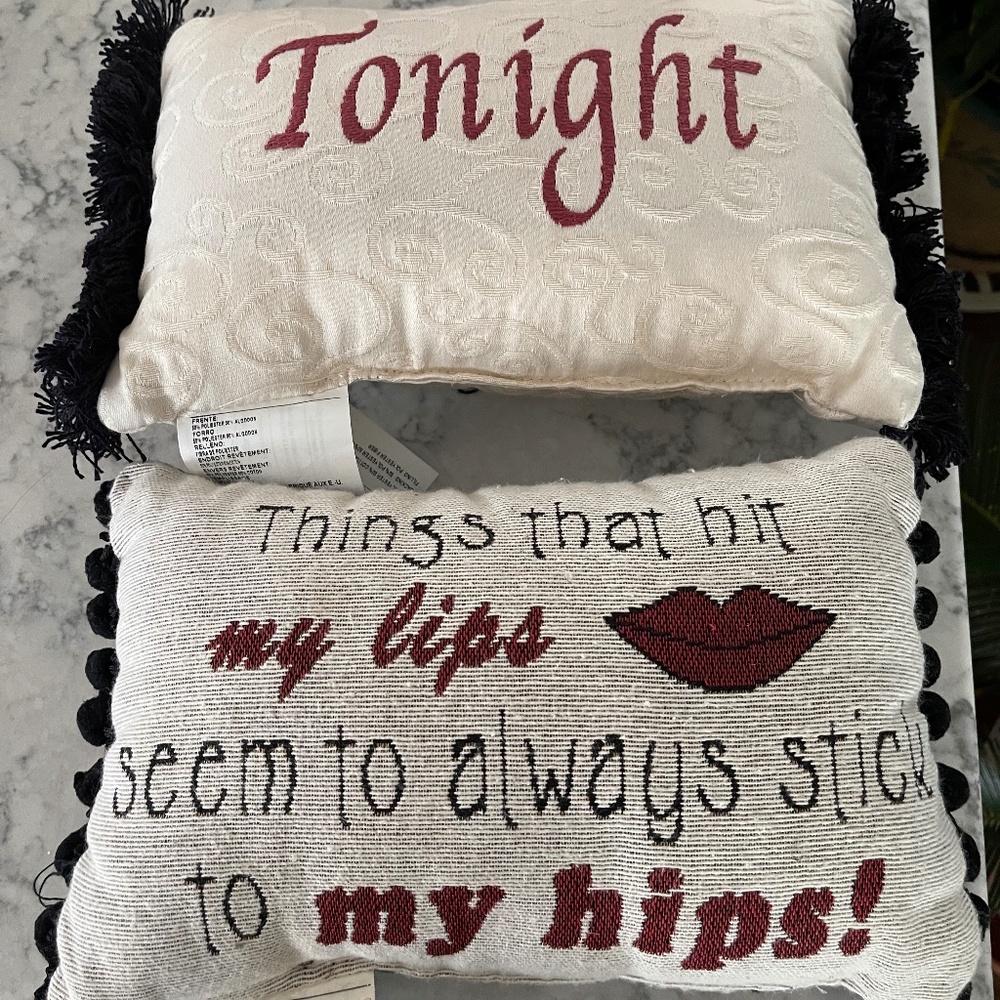 Two small pillows with sayings.